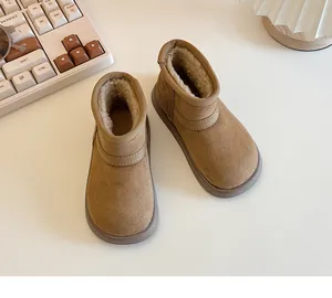 Detail shot of warm kids fur-lined snow boots in tan with anti-slip soles