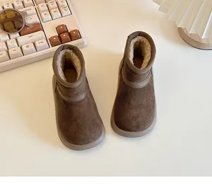 Close-up of cozy brown fleece-lined winter snow boots for kids with anti-slip soles
