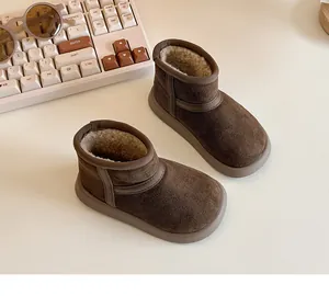 Brown children's snow boots featuring thick warm plush lining and non-slip rubber soles