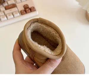 Detailed close-up showing the thick warm faux fur lining inside a children's snow boot.