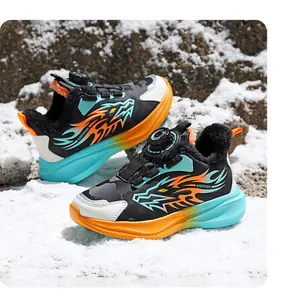Detail view showing the vibrant dragon flame pattern on children's winter sports shoes