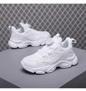 Detail shot of white boys breathable chunky sneakers with rotary knob lacing system