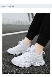 White breathable chunky sneakers for boys featuring a quick-adjust rotary dial lace system