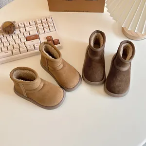 Warm children's snow boots with thick faux fur lining and non-slip soles in tan and brown