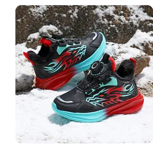 Boy's winter sports sneakers with warm plush lining and dragon pattern shown in snow