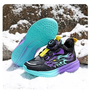 Detail of children's winter sports shoes with thick faux fur lining and rotary buckle