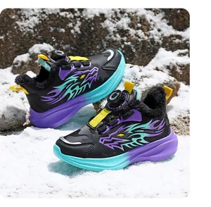 Detail of winter children's snow sneakers with warm fur lining and dragon pattern
