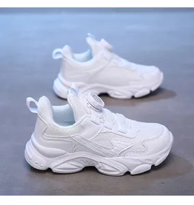 Close-up of white breathable chunky sneakers for boys with quick-lace dial system