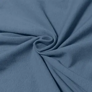 Macro view showing the soft texture of blue pure cotton fabric for men's casual T-shirt