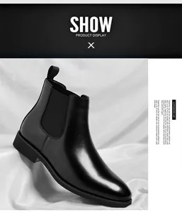 Macro view of a classic black leather Chelsea boot for men with elastic side panels