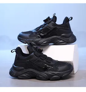 All-black breathable sports sneakers for boys with quick-lace rotary dial system detail