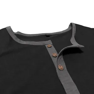 Detailed view of men's cotton long sleeve t-shirt neckline and wooden buttons