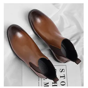 High-angle view of vintage brown leather Chelsea boots with hand-polished gradient toe finish