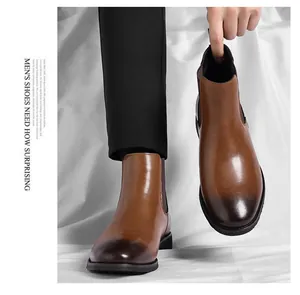 Close-up view of premium brown leather Chelsea boots for men with retro gradient toe