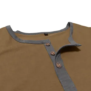 Close-up detail of men's cotton Henley neck T-shirt with grey trim and buttons