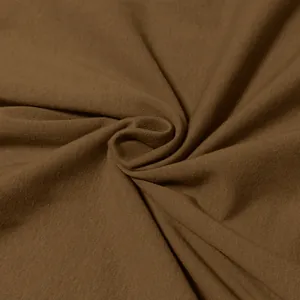 Detailed macro view of high-quality brown cotton knitted fabric texture for t-shirts