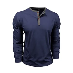 Close-up detail of navy blue long-sleeved cotton Henley t-shirt with grey collar trim