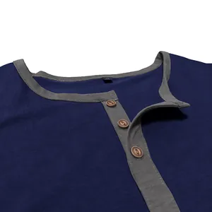 Close-up detail showing the button placket and grey trim of this navy cotton T-shirt