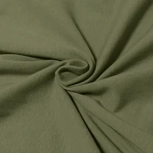 Close-up macro view of high-quality soft olive green cotton jersey fabric texture