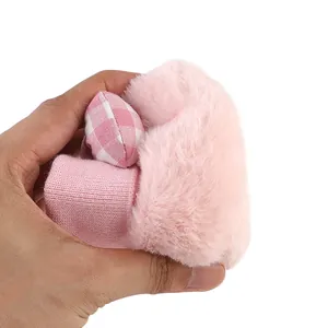 Close-up showing the ultra-soft plush material and knit texture of pink baby winter walker shoes