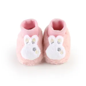 Soft pink fuzzy baby winter walker shoes with a cute white rabbit embroidery design