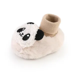 Close-up detail of plush panda baby slipper socks featuring a soft knitted ankle cuff.