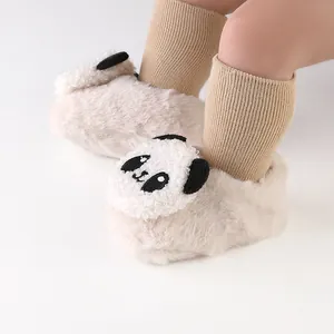 Detailed view of plush baby winter slippers featuring a cute panda design and soft fur