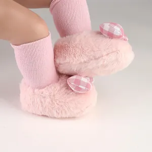 Soft pink fuzzy baby shoes with checkered bow for newborn girls winter walking