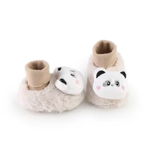 Close-up detail of cute panda embroidery on fuzzy baby winter pre-walker booties.