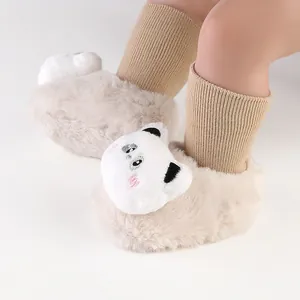 Close-up of plush baby panda slippers with cozy thick lining for newborn floor walking