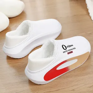 Detail showing the white plush lining and side print of these warm winter slippers