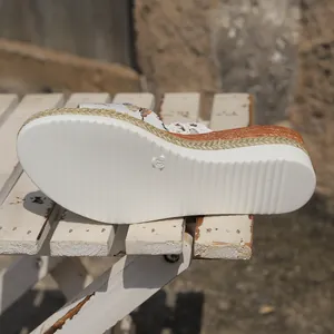 Close-up showing the white ridged anti-slip outsole and woven rope wedge sole detail