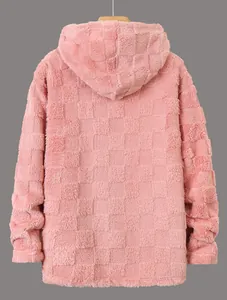 Macro view of pink fuzzy hooded sweatshirt with checkered texture detail.
