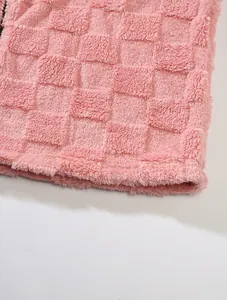 Detail shot showing the pink checkerboard waffle fleece fabric texture for winter hoodie