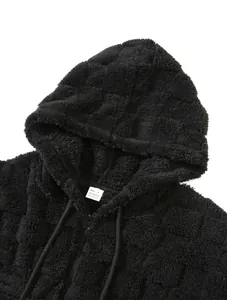 Detail of black thick fleece hooded zip-up sweatshirt showing soft plush texture