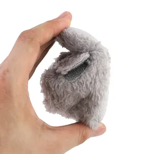 Close-up of gray plush baby shoes showing soft material and velcro strap closure
