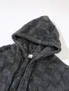 Detailed texture of a grey checkered fleece zip-up hoodie with hood and drawstring
