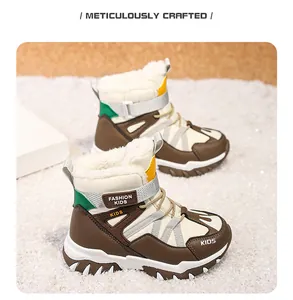 Detailed view of warm children's snow boots with thick plush lining and anti-slip sole