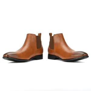 Detailed side view of tan leather men's Chelsea boots with square toe and elastic panels