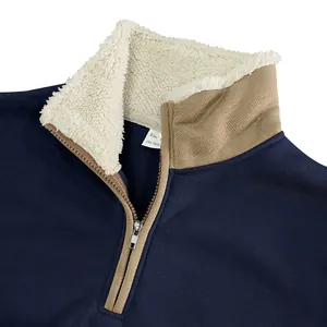 Detailed view of navy blue men's half-zip sweatshirt with a warm sherpa-lined collar