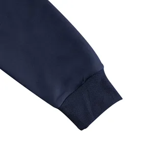 Detailed close-up showing the ribbed cuff and fabric texture of a navy blue hoodie sleeve