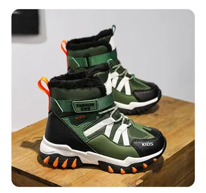 Detailed side view of green children's winter snow boots featuring warm faux fur lining