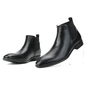 Close-up of black men's Chelsea boots with a modern square toe and elastic sides