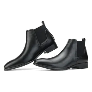 Side view detail of stylish black men's Chelsea boots with a small square toe design.