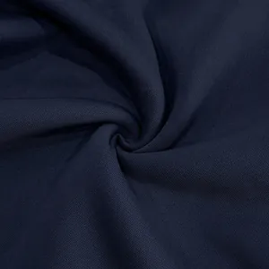 Close-up macro view of navy blue vintage sweatshirt fabric texture with twill patterns.
