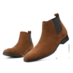 Detailed view of brown suede men's Chelsea boots with elegant square toe design.
