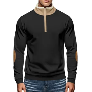 Detail view of men's vintage black half-zip sweatshirt with contrast collar and elbow patches.