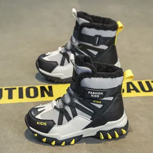 Warm winter snow boots for boys aged 6-12 with thick fleece lining and non-slip sole.