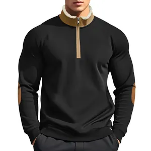 Detailed view of men's black half-zip sweatshirt with tan collar and elbow patches