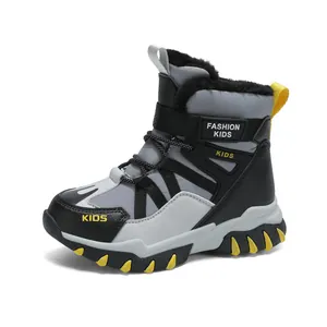 Warm fleece-lined kids snow boots in grey and black, ideal for winter outdoor play activities.